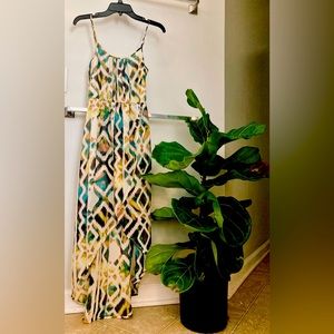 Wonderful pull on high-low faux wrap dress. Love this. Small.